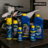 Putoline olie en onderhoudsproducten op werkbank in crossmotor garage met MX Pro Store branding
